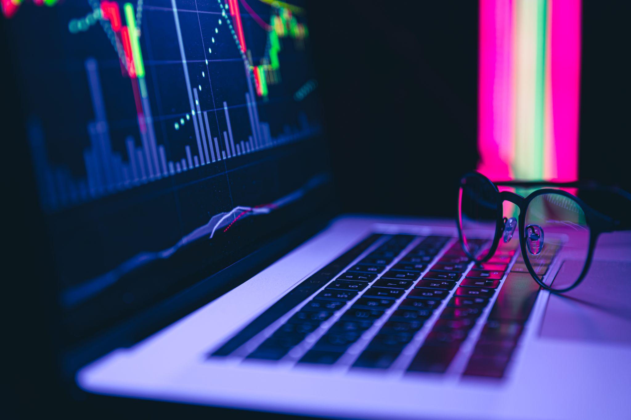 Laptop on desk, potentially for crypto trading or Block