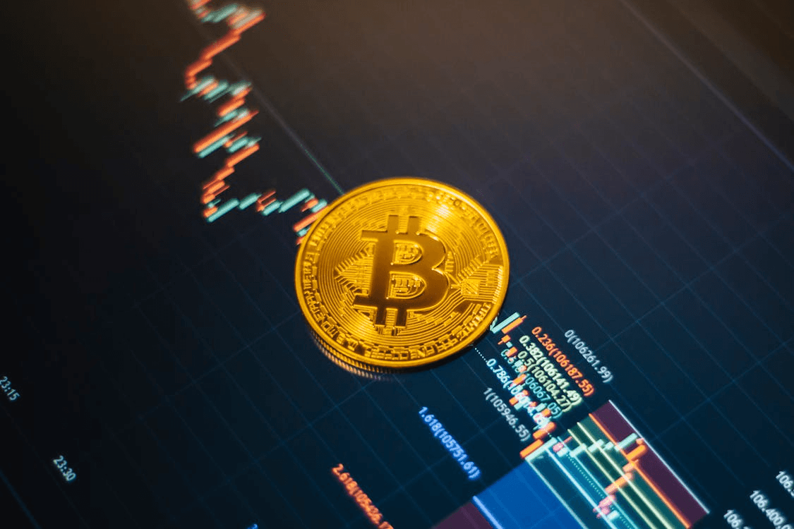 Bitcoin coin on a cryptocurrency market chart