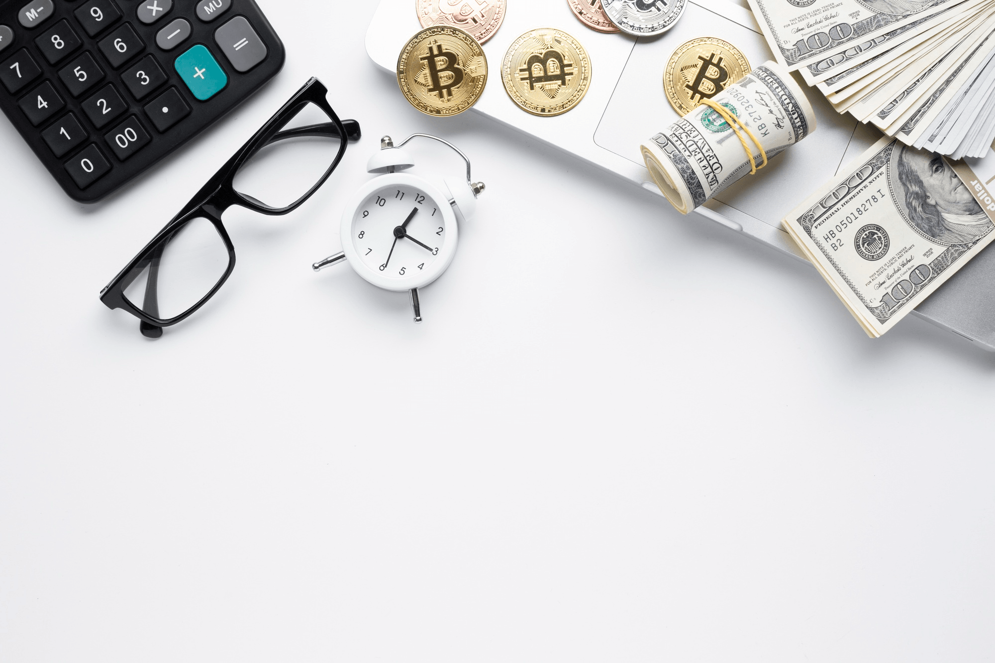 Calculator, eyeglasses, and money indicating financial analysis or