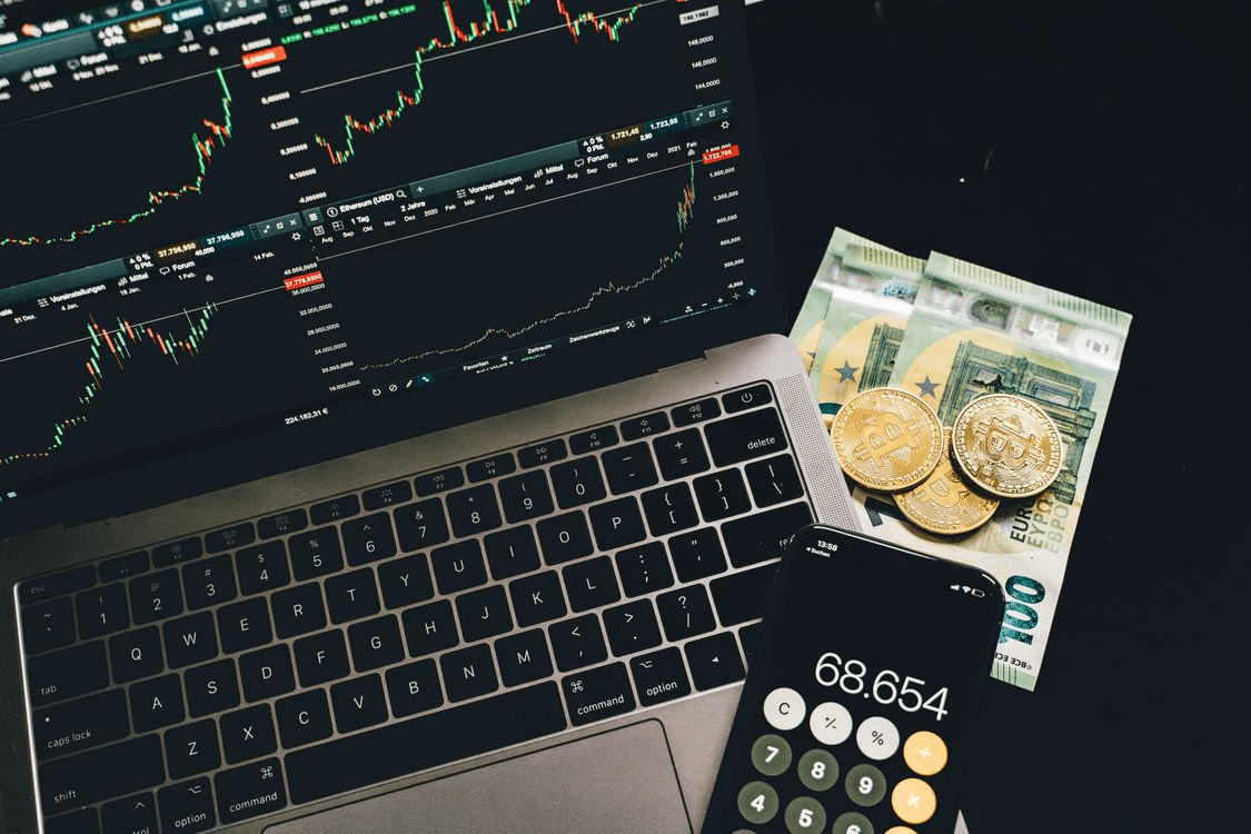 laptop and calculator for financial analysis of