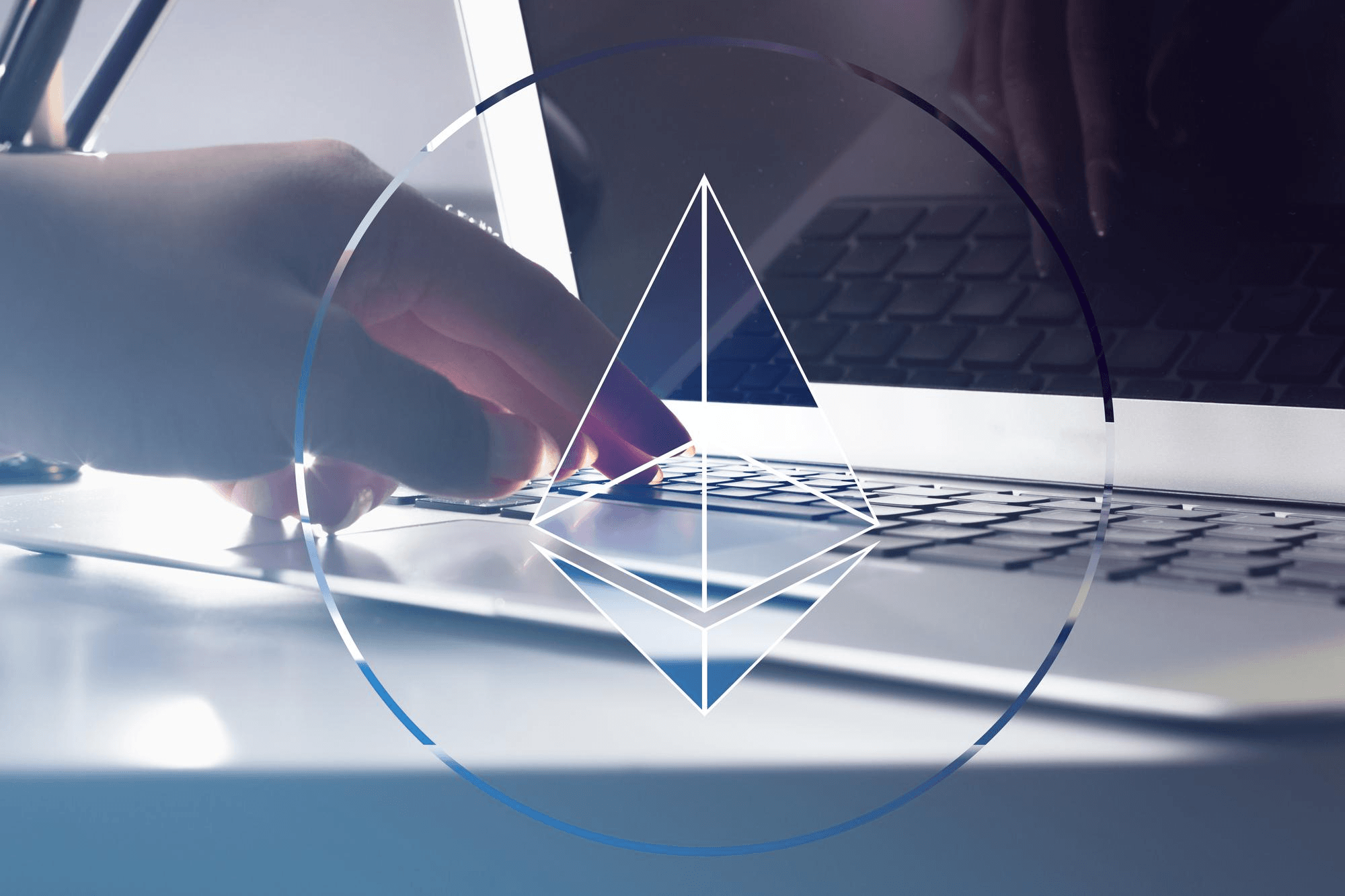 Person using laptop with a cryptocurrency symbol on screen,